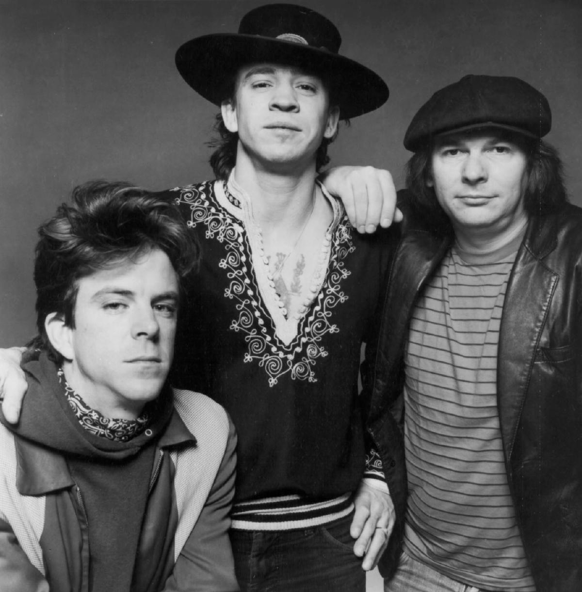 Stevie Ray Vaughan and Double Trouble in a 1983 publicity photo, the Texas Flood era. From left: Chris Layton, Vaughan, and Tommy Shannon.