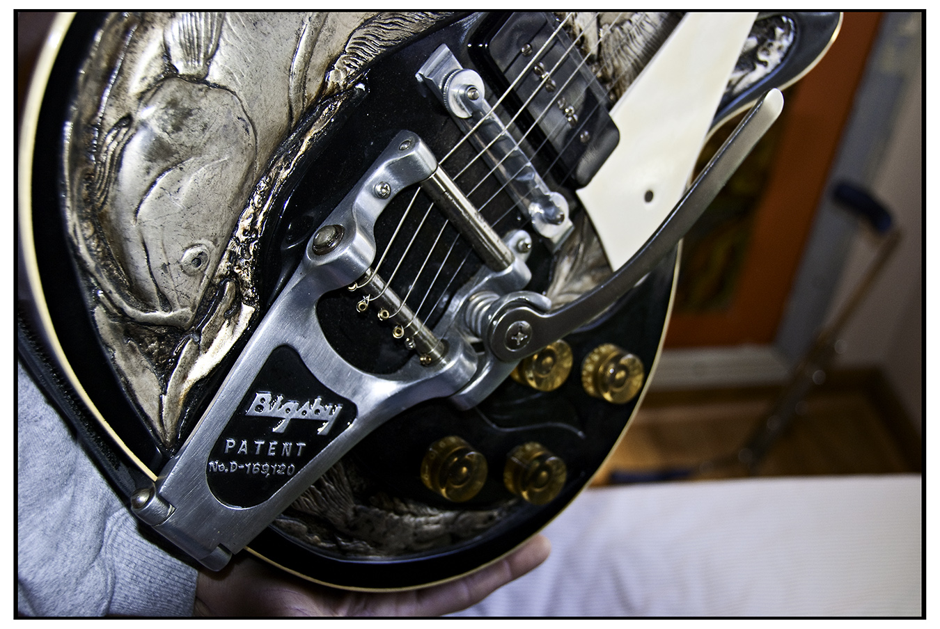 Chrome Bigsby vibrato tailpiece on a Les Paul with a carved top