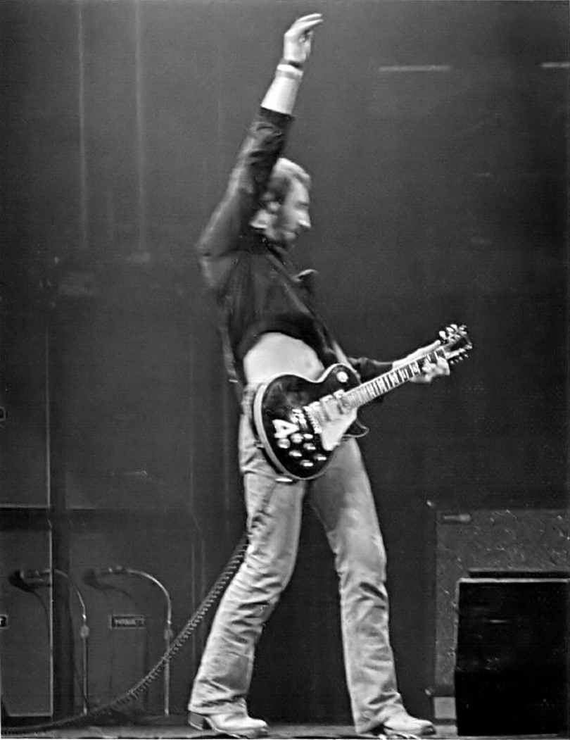 Pete Townshend mid-windmill