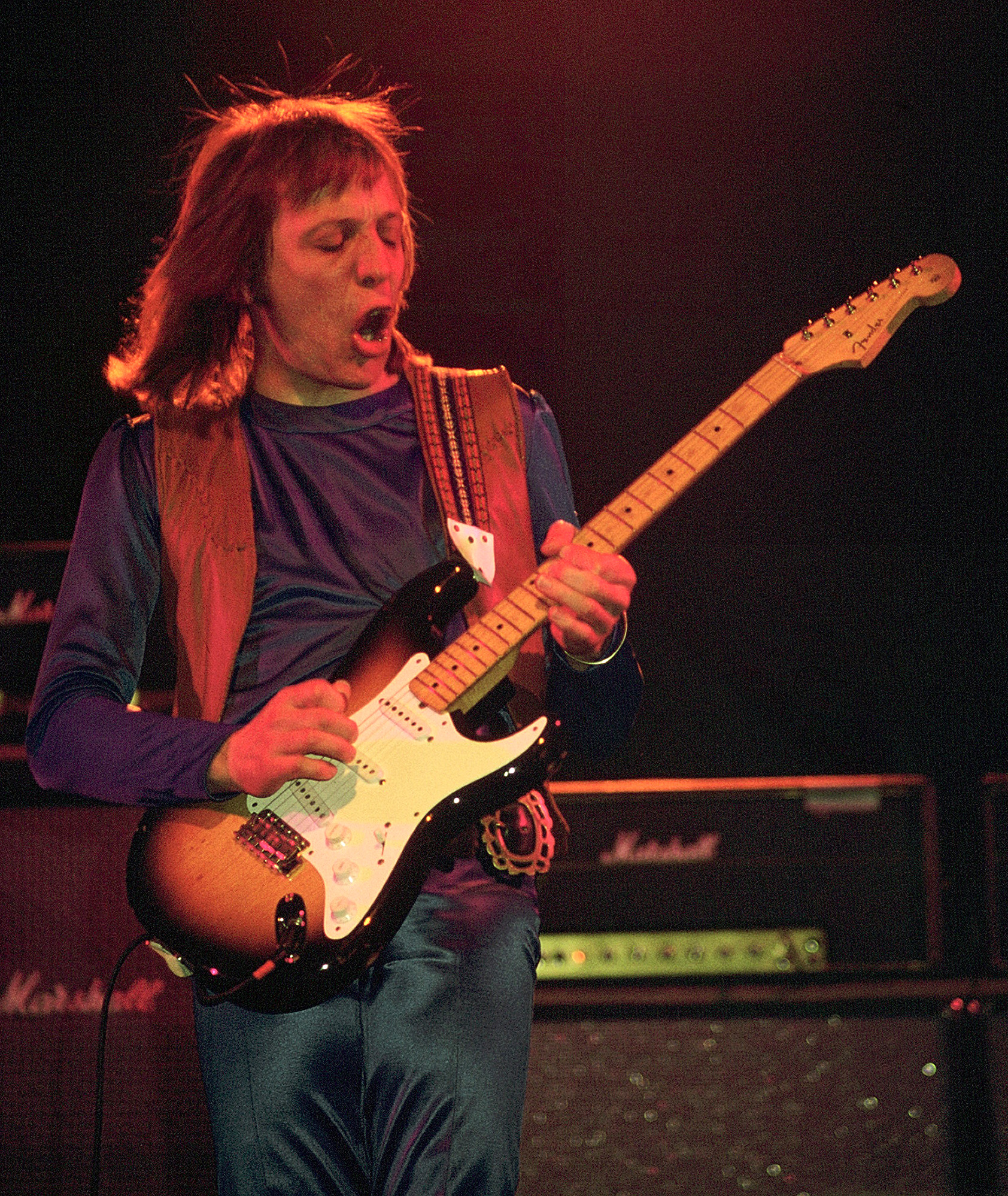 Robin Trower playing a Fender Stratocaster onstage in 1975