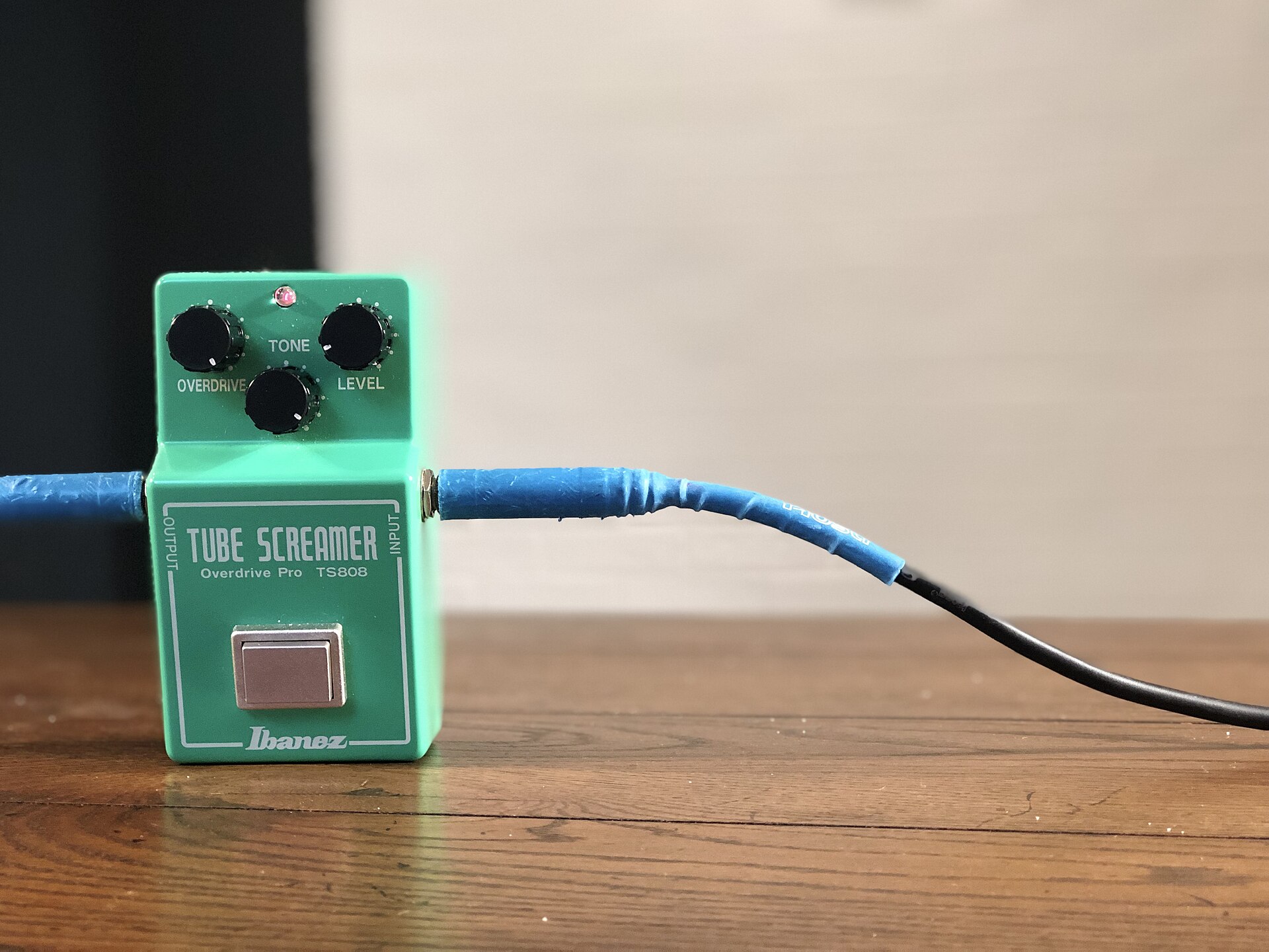 Ibanez TS808 Tube Screamer pedal fully visible on a wooden surface