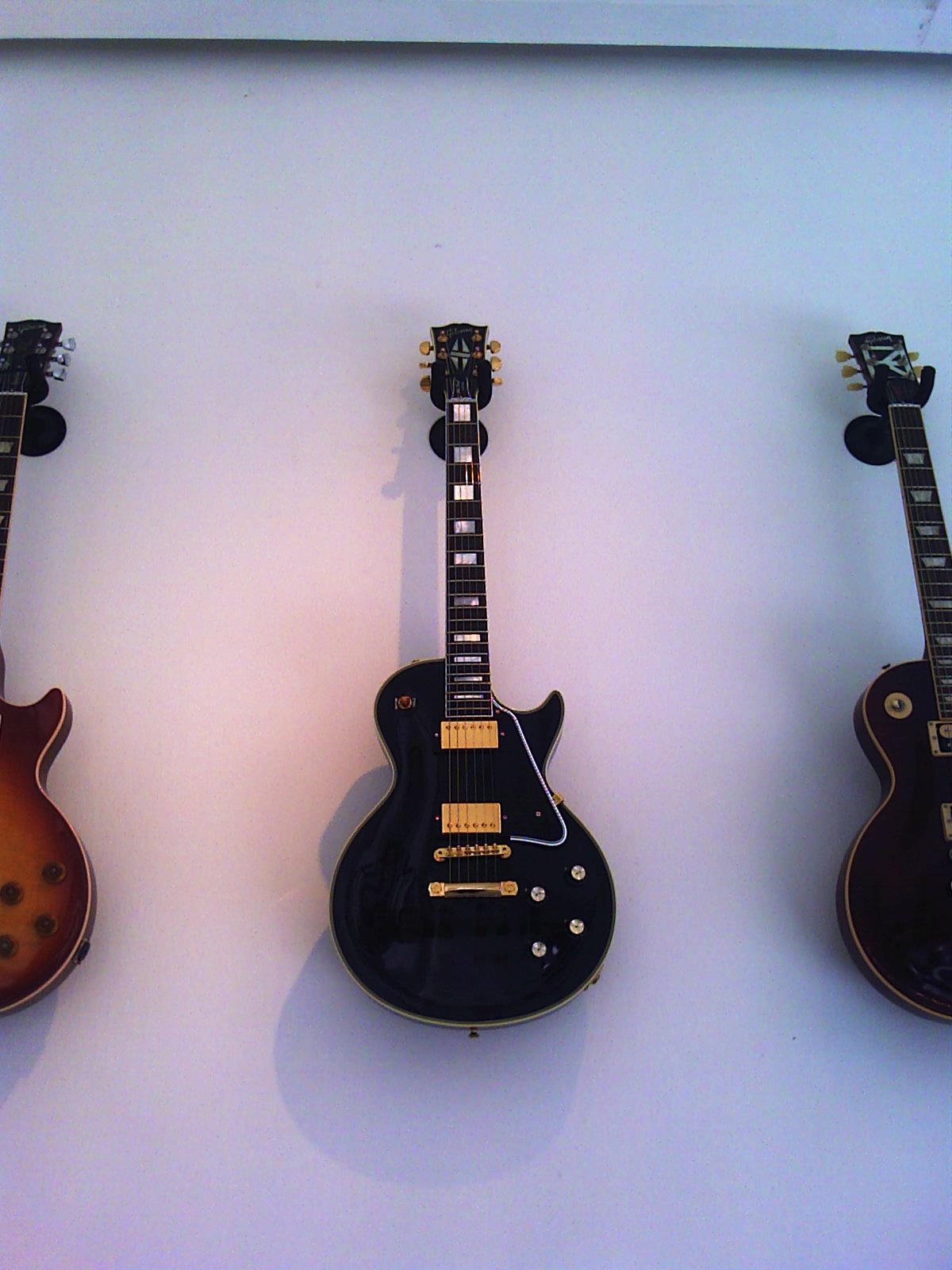 A black Gibson Les Paul Custom. Gaines is widely pictured with a black Custom in 1976–77. **Illustrative:** a modern Gibson reissue, not his guitar.