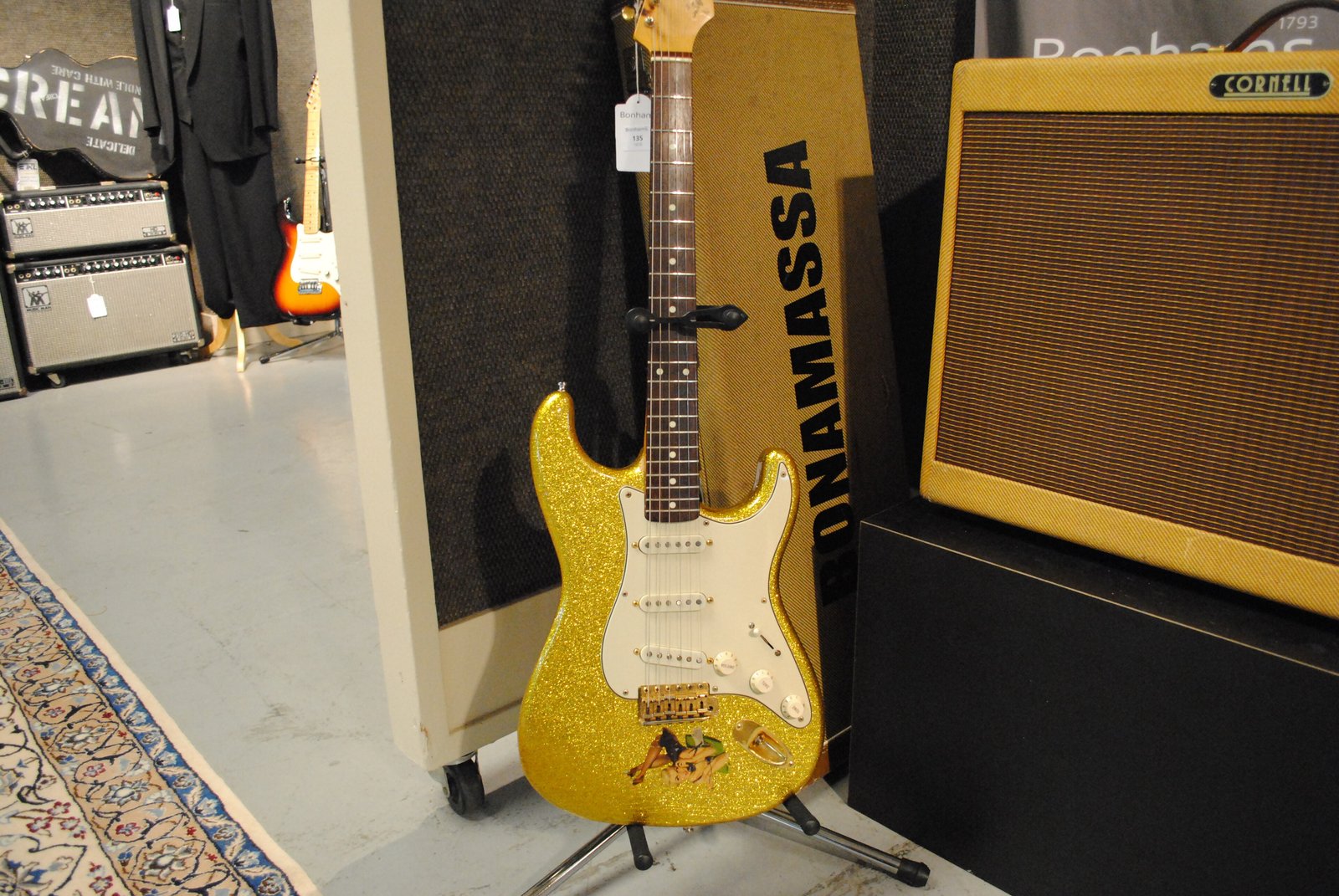 A gold-sparkle Fender Stratocaster donated by Joe Bonamassa to Eric Clapton's 2011 Crossroads Centre guitar auction at Bonhams. Illustrative: not the white Strat he played at Radio City.