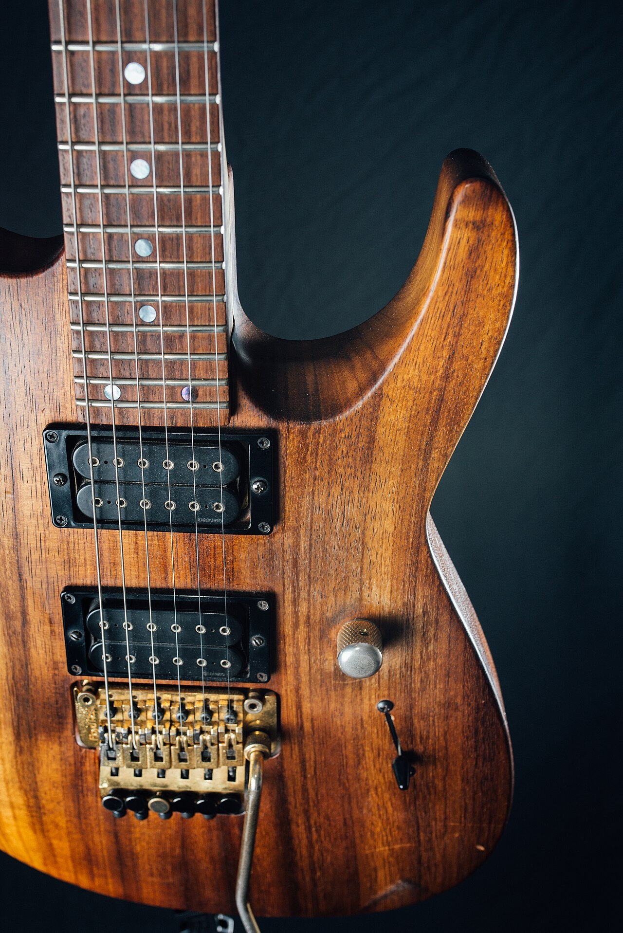 Wooden electric guitar body and strings