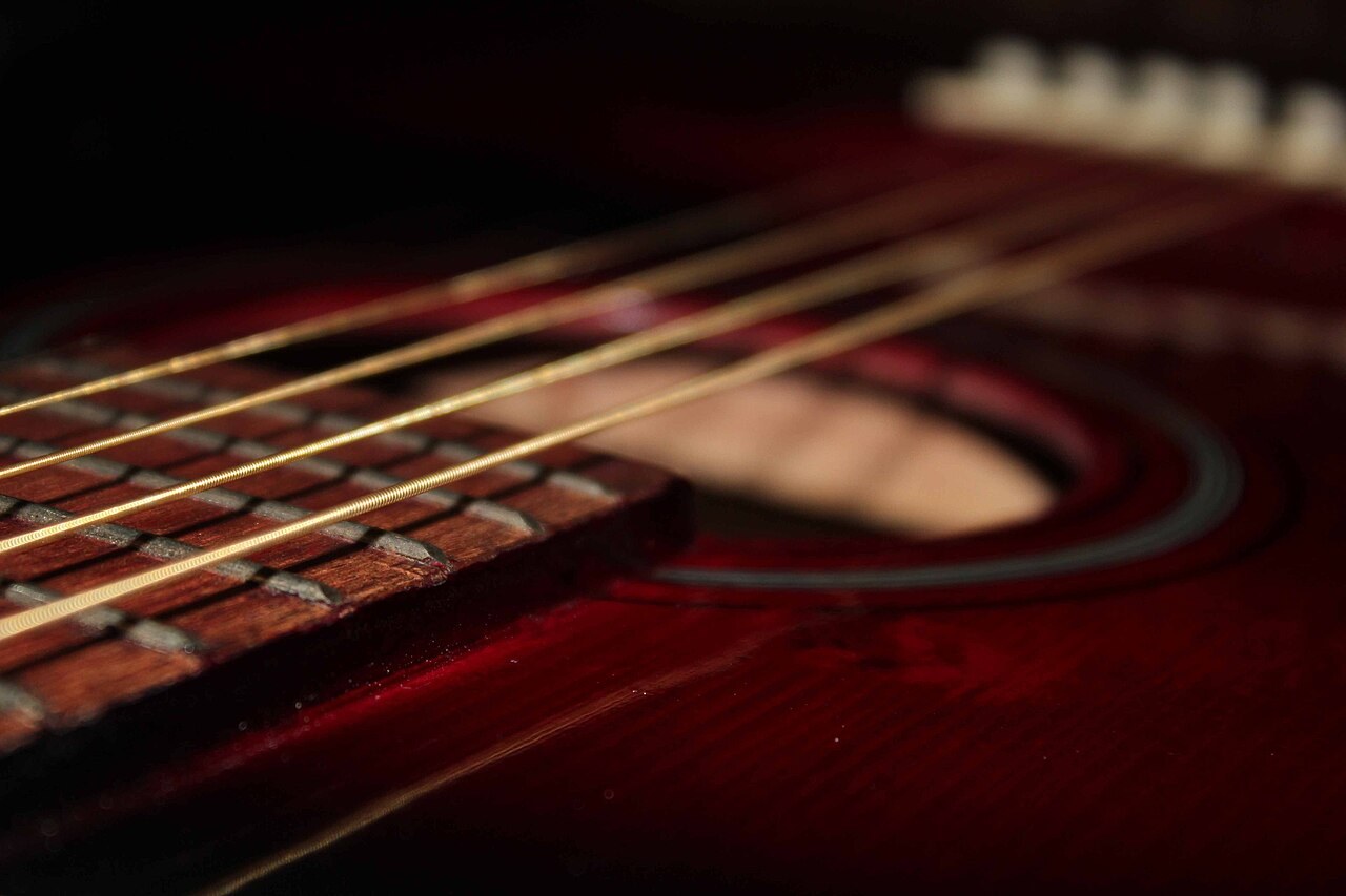 Acoustic guitar strings near the sound hole