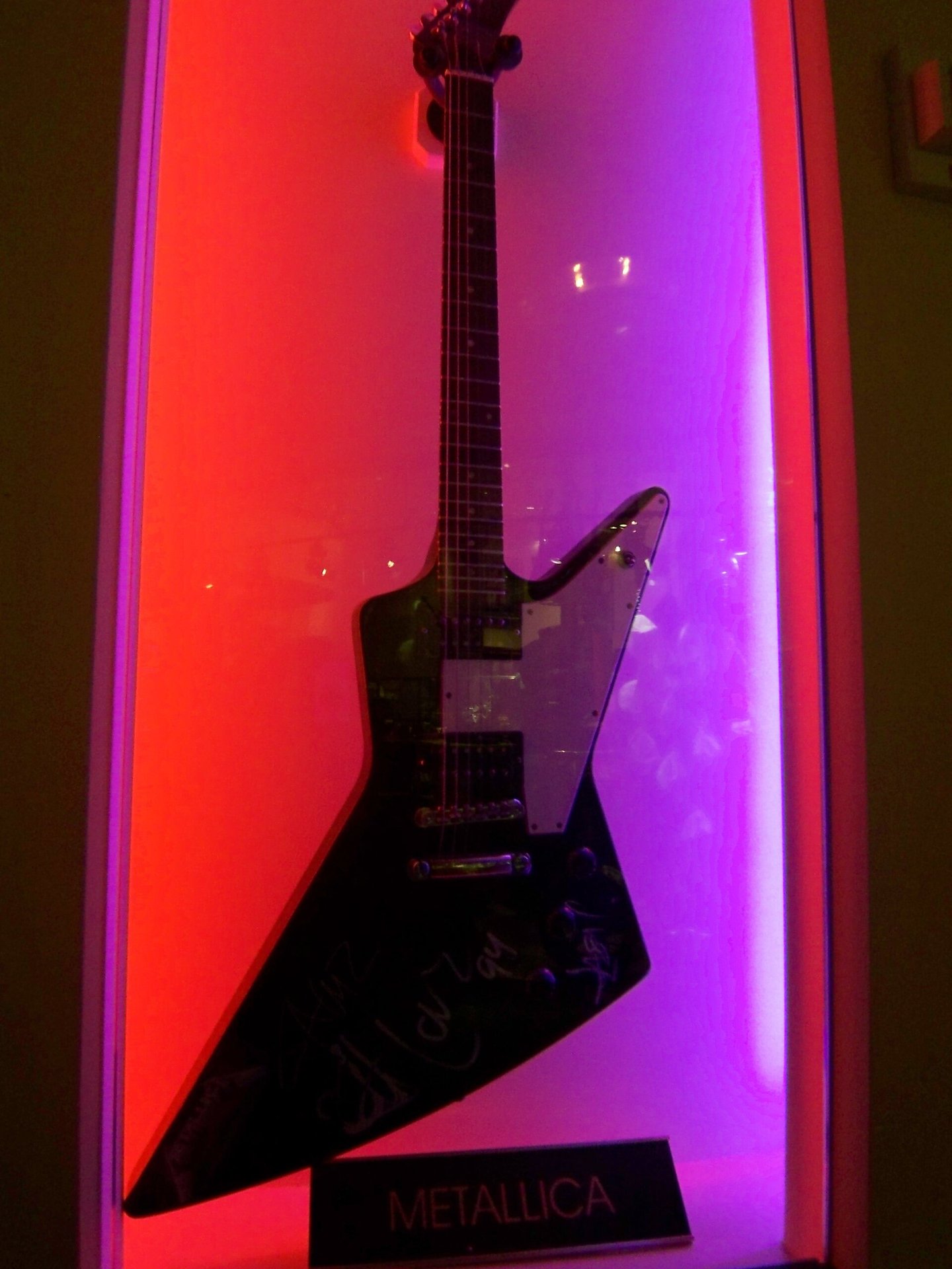A Metallica-associated Gibson Explorer on display at the Hard Rock Cafe in Las Vegas. **Illustrative:** not confirmed as the white Explorer from *Master of Puppets*.