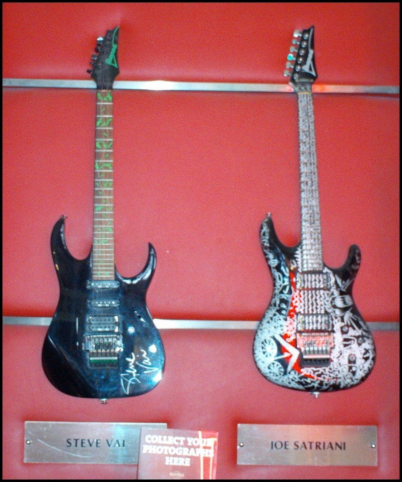 Guitars belonging to Vai and Satriani on display at the Hard Rock Cafe in London.