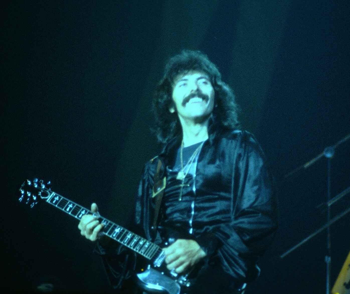 A young Tony Iommi with a Gibson SG onstage with Black Sabbath at the New Haven Coliseum in 1978