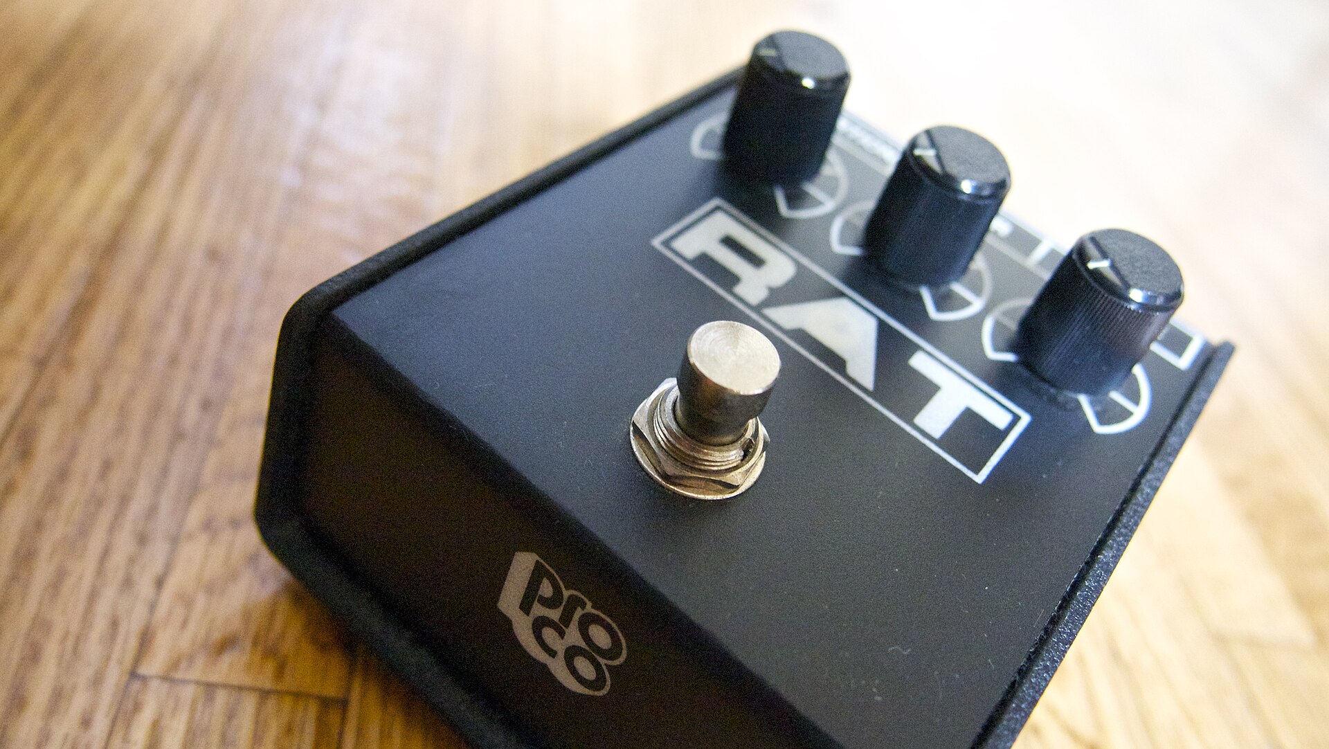 ProCo RAT2 pedal in the sloped enclosure, angled view