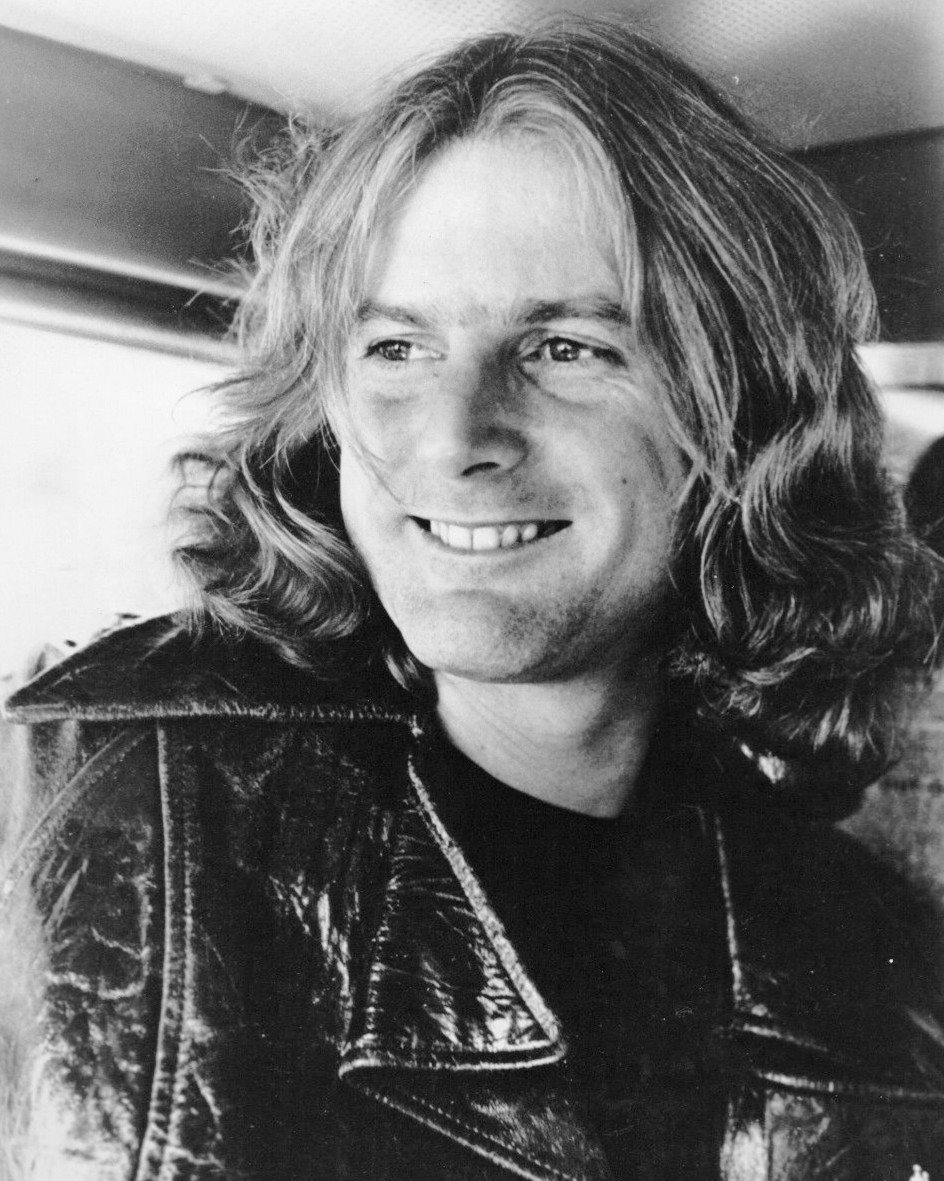 Roger McGuinn smiling in a 1976 Columbia Records publicity portrait