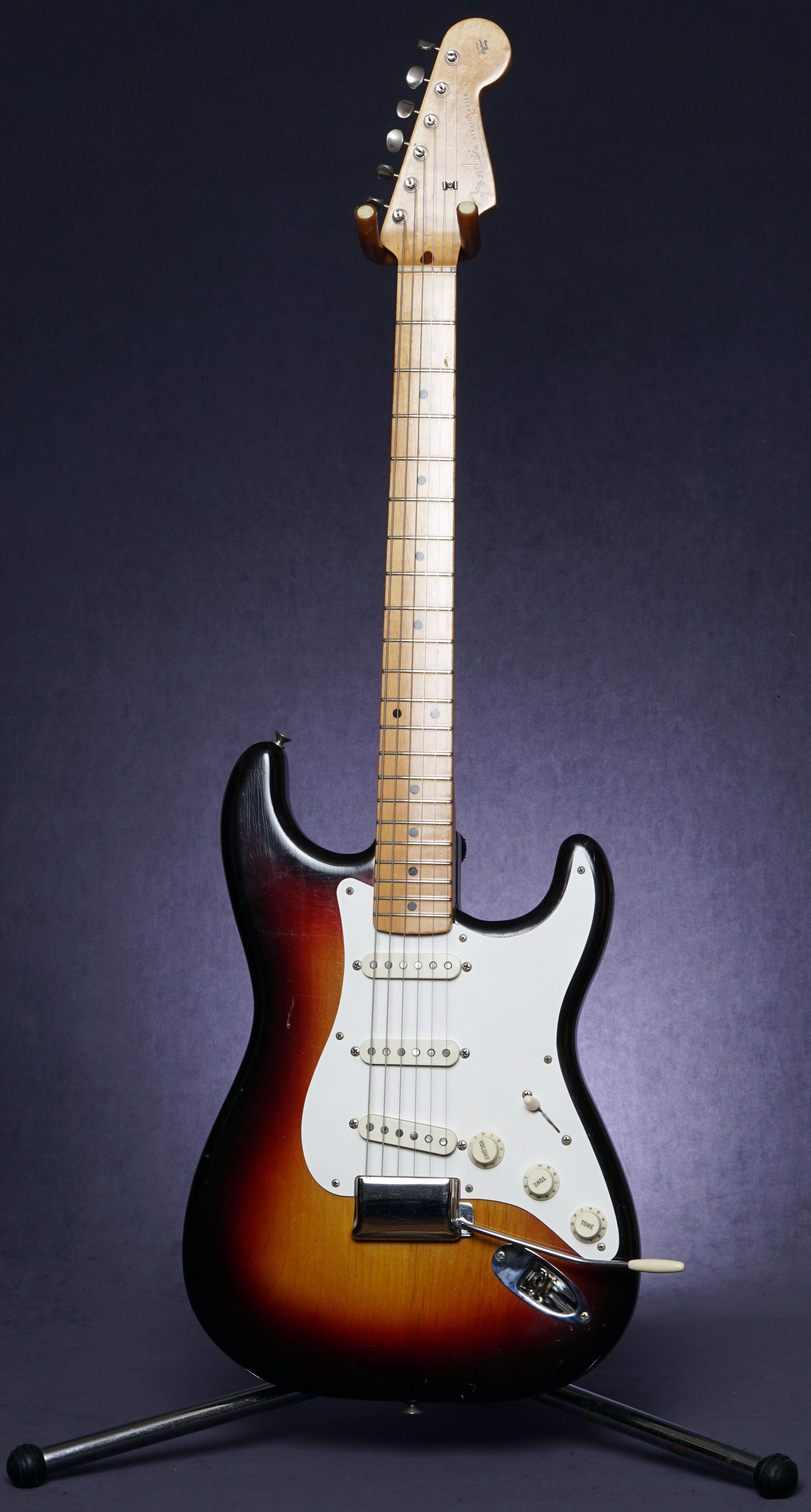 A complete 1958 Fender Stratocaster in three-color sunburst with a maple neck, white pickguard, three single-coil pickups and chrome bridge cover