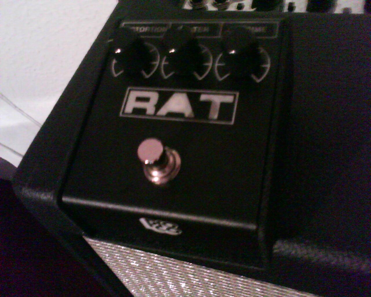 A ProCo RAT pedal sitting on top of a Fender Hot Rod Deluxe amplifier
