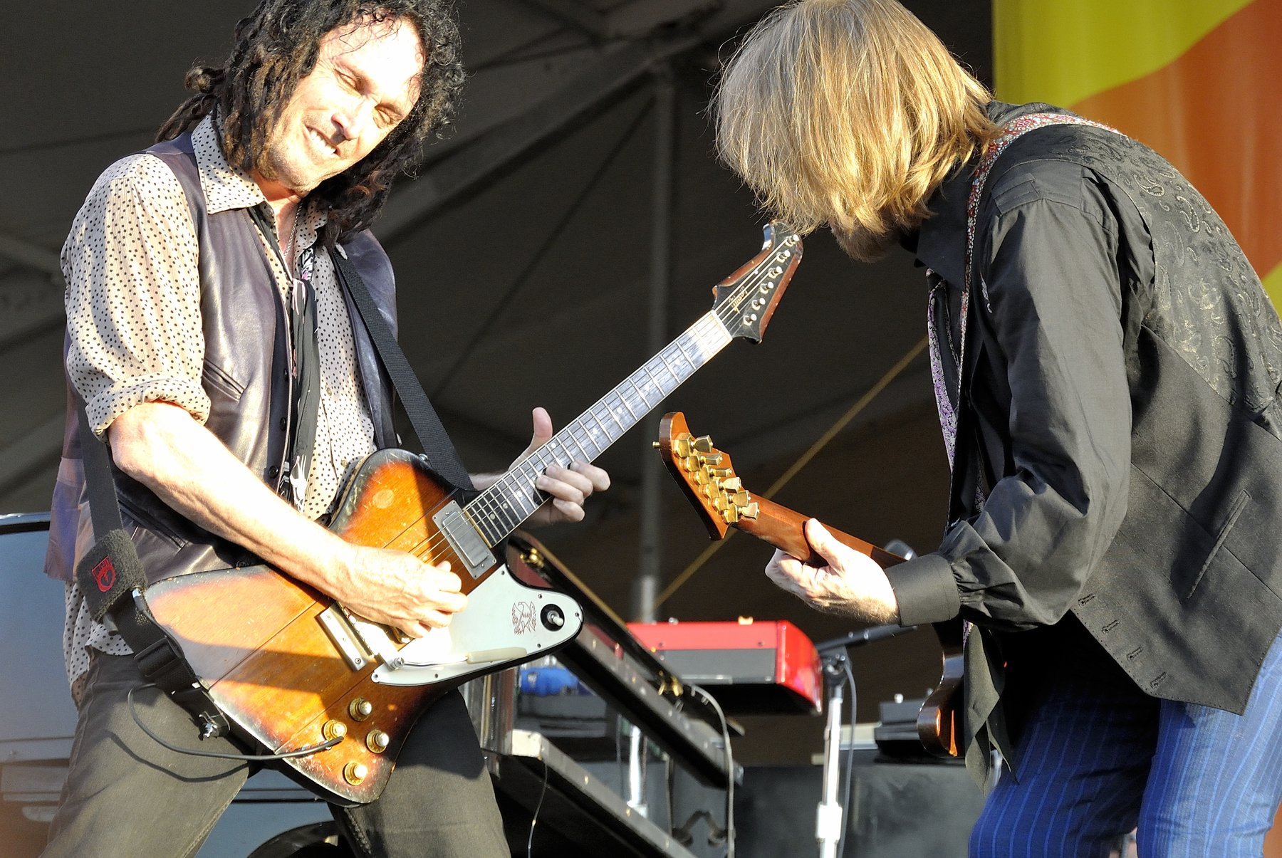 Mike Campbell and Tom Petty performing on stage