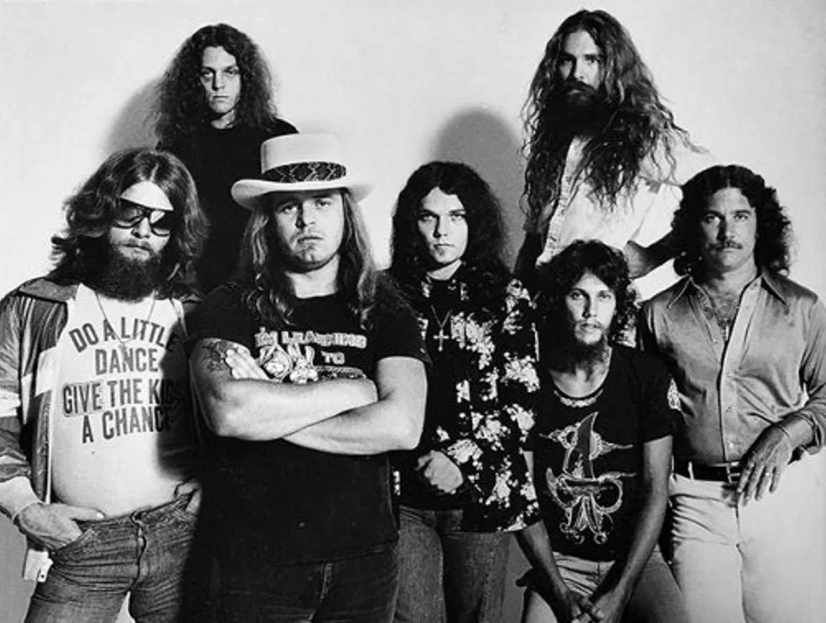 Lynyrd Skynyrd in a 1977 MCA trade ad, the lineup that made *Street Survivors*: Leon Wilkeson, Allen Collins, Ronnie Van Zant, Gary Rossington, Steve Gaines, Artimus Pyle and Billy Powell.