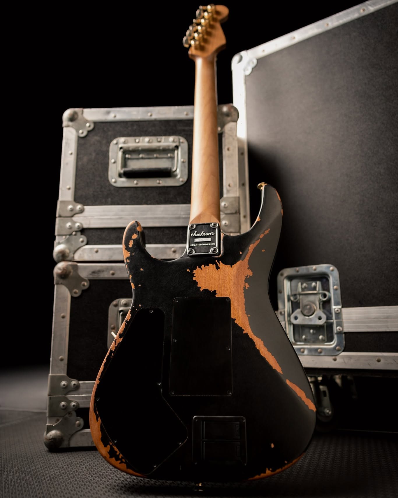 Back of the Jackson PC1-E showing cavity covers and Crafted in Mexico neck plate